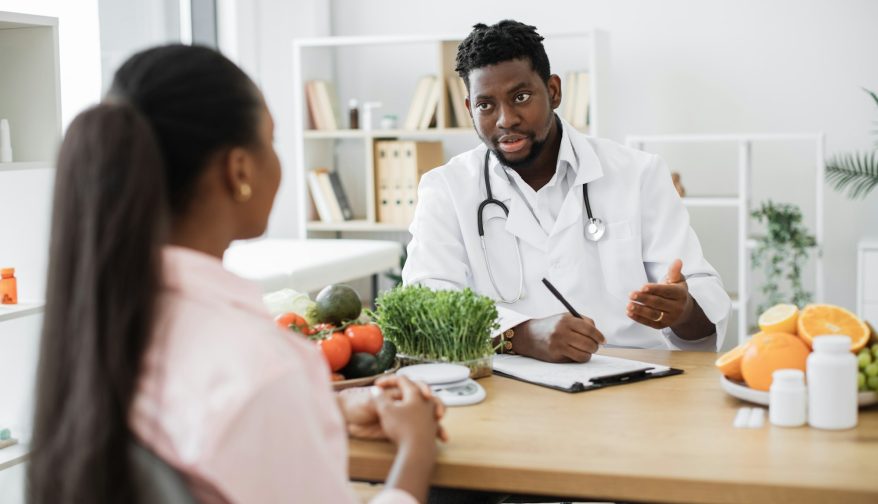 Specialist in nutrition advising client about food choices